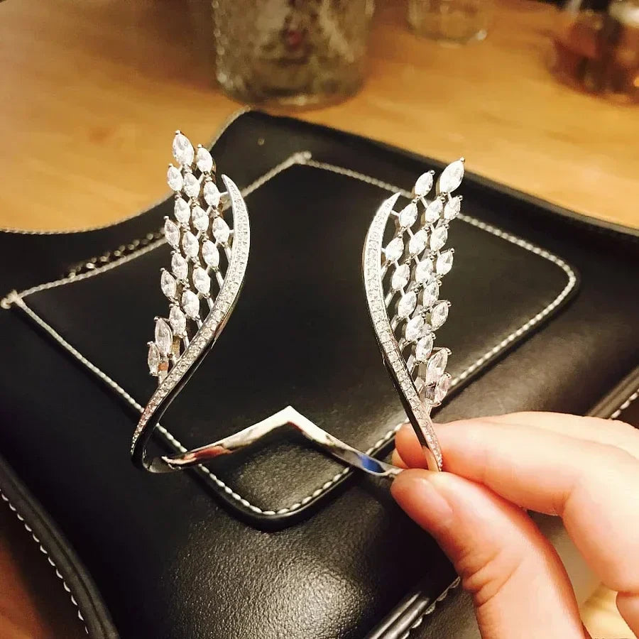 Evita – Armband und Ring mit Engelsflügeln