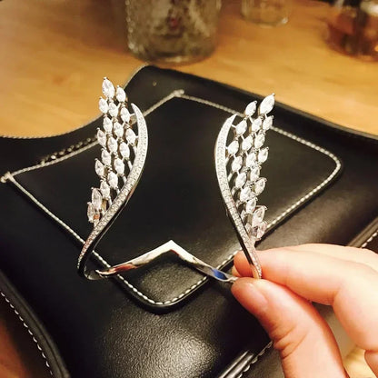 Evita – Armband und Ring mit Engelsflügeln